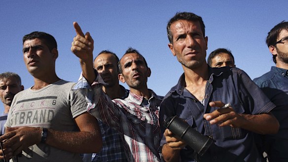 A crowd gathered in Mursitpinar to watch as Islamic State militants closed in on Kobani.