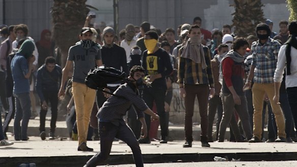 Egyptian students who support the Muslim Brotherhood following a demonstration outside Cairo University last year. 