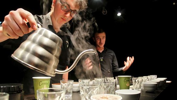 A pricey cuppa: Matt Dessaix conducts a cupping featuring Ironman Geisha coffee while Dylan pours.