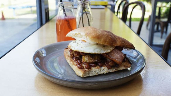 The bacon, egg and hash roll with house barbecue sauce.
