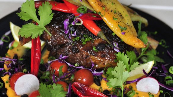 Food and Wine.  Food review Elk and Pea in Braddon.  Chipotle, Ancho Chilli and Cumin Lamb -roasted whole lamb shoulder served with sweet potato puree, turtle beans, rosemary kipflers and banana chillis.  4 April 2015.  Canberra Times photo by Jeffrey Chan.