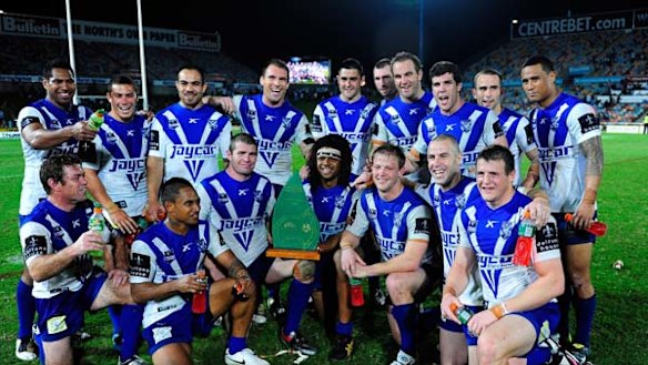 The Bulldogs pose with the reconciliation trophy after beating the North Queensland Cowboys at Dairy Farmers Stadium.