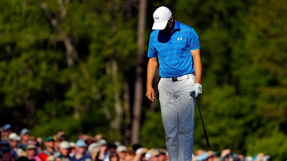 Jordan Spieth reacts after hitting his tee shot into the water on the 12th.