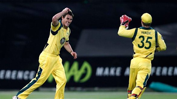Patrick Cummins celebrates the dismissal of Johan Botha.