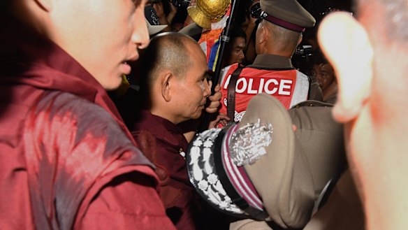 Kruba Boonchum, second from left, moments after returning from Tham Luang cave where he prayed with the trapped boys' families.