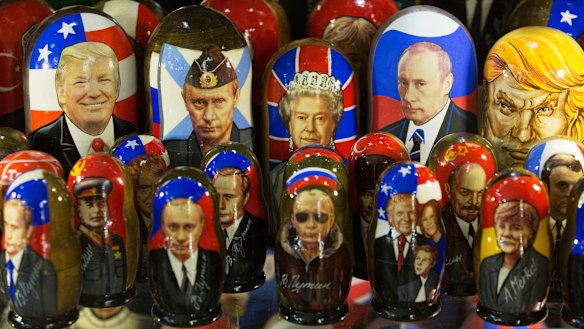 A gift shop displays souvenir matryoshka dolls decorated with the faces of Vladimir Putin, Donald Trump and Queen Elizabeth.
