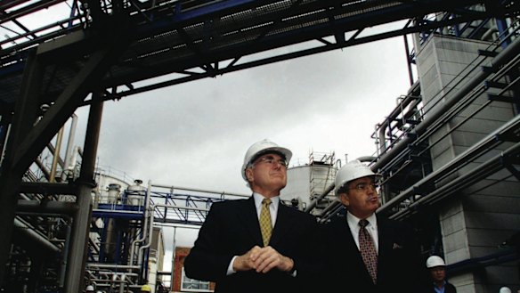 Manildra's Dick Honan (right) showing then prime minister John Howard around the company's ethanol plant in Bomaderry.