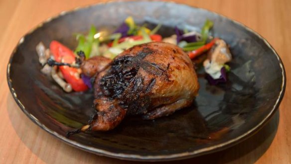 Jumbo quail stuffed with black rice and lap cheong.