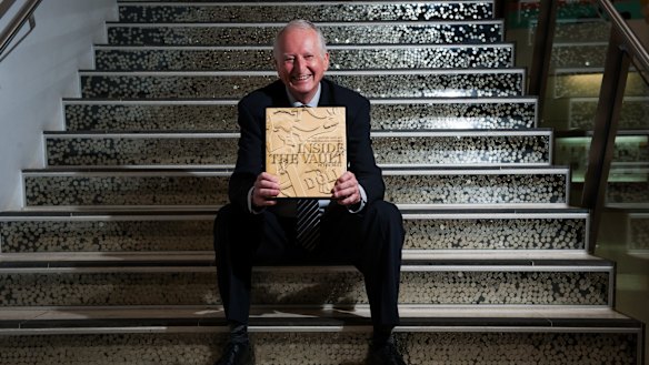 Canberra author Peter Rees at the Royal Australian Mint with his book Inside the Vault: The history and art of Australian coinage.