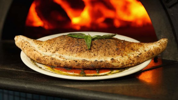 The calzone special served with napoli sauce.