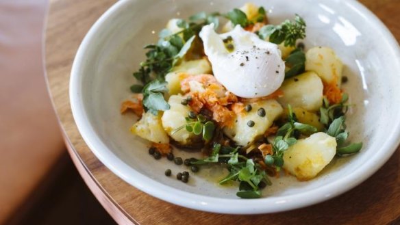 Crushed potato, smoked trout, capers, watercress and a poached egg at the Butcher's Daughter, Elwood.