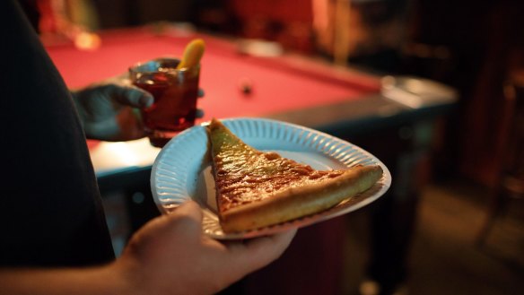 Classic cheese pizza at Connie's inside Heartbreaker Bar.