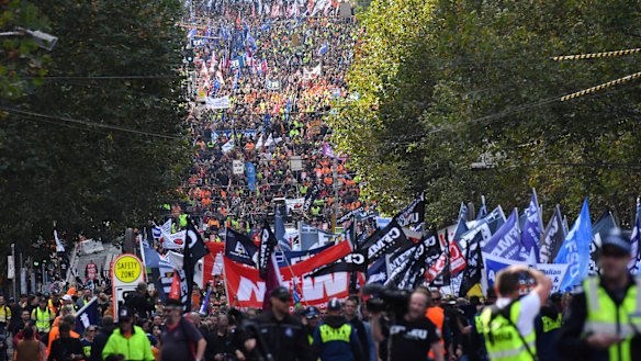Workers filled LaTrobe Street as they make their way to the Magistrates Court.