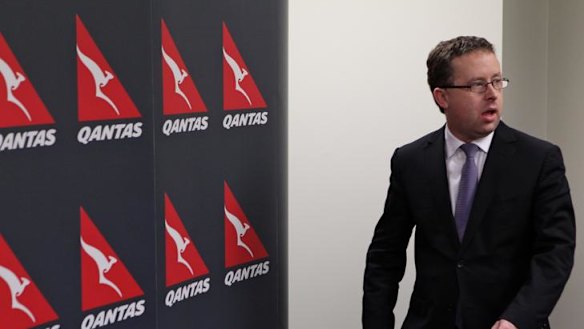 Qantas CEO Alan Joyce holds a media conference to announce the grounding of all flights.