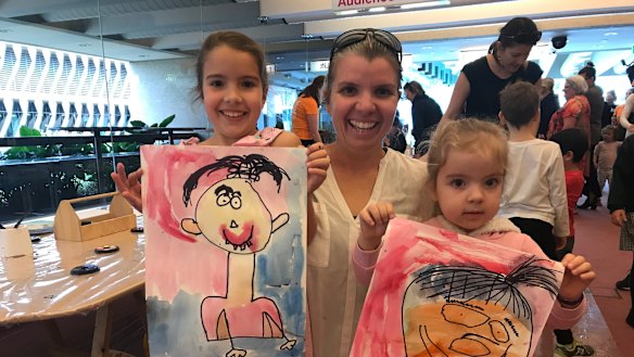 Stephanie Smith with her two daughters Izzy, 6, and Mia, 3, at the Out of the Box Festival in Brisbane on Tuesday.