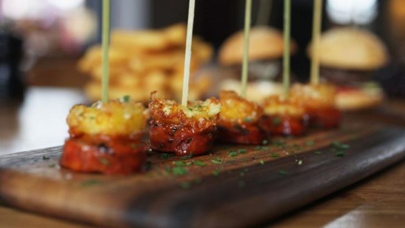 Grilled chorizo and haloumi skewers.