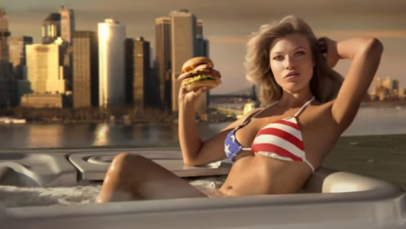 Sports Illustrated model Samantha Hoopes, in a hot tub, advertises the Most American Thickburger.