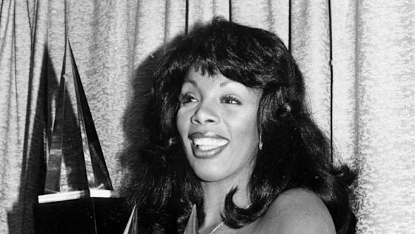 Donna Summer poses with three awards she won at the American Music Awards in 1979.