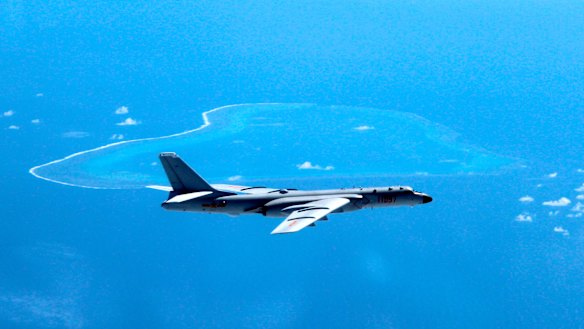 A Chinese H-6K bomber patrols the islands and reefs in the South China Sea.
