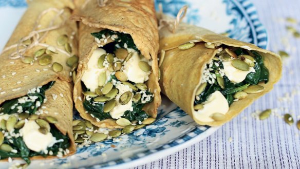 Almond flour crepes with ricotta, wilted greens and toasted seeds.