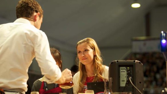 Judge Petra Vesela samples coffee from Australian champion Matt Perger at the World Barista Championships.