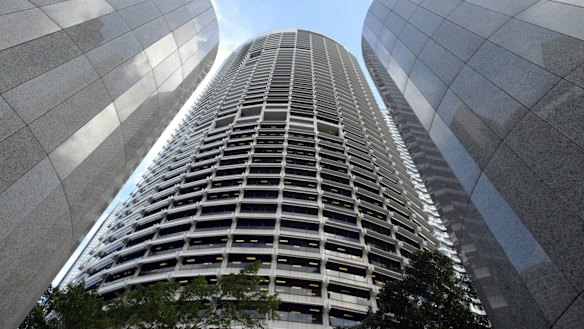 The Grosvenor Place skyscraper towers over entrance columns and the complex's courtyard in central Sydney.