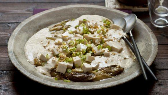 Yellow miso eggplant with tofu dressing, fried ginger and garlic.