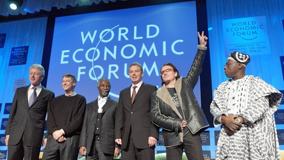 At Davos in 2005 are )from left) Bill Clinton, Microsoft's Bill Gates, South Africa's Thabo Mbeki, British PM Tony Blair, Irish rock star Bono and Nigerian President Olusegun Obasanjo. 