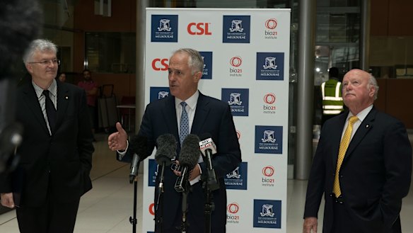 Glyn Davis (left) and Malcolm Turnbull (centre) jousted over industry collaboration last year. Pictured with CSL chairman John Shine at the announcement of a 5000-square-metre expansion of the university's  Bio21 Molecular Science and Biotechnology Institute