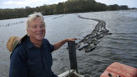 Job with a view: Kevin McAsh at the 20-hectare oyster farm near Batemans Bay.