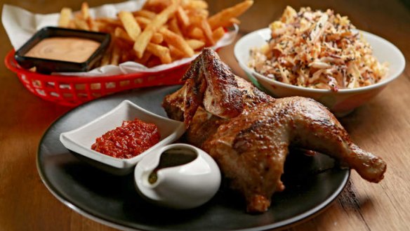 Rotisserie chicken with slaw and fries.