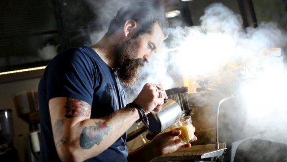 Barista Sean McManus makes coffee at Single Origin, Surry Hills.