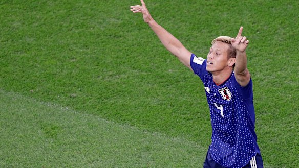 Keisuke Honda celebrates his equaliser for Japan.