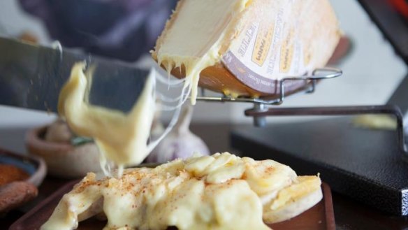 Cheese of your dreams: raclette being scraped over confit potatoes