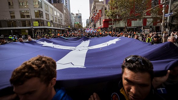 Workers march through the city