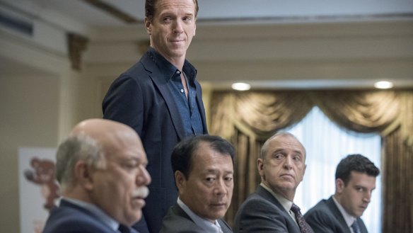 Damian Lewis (standing) plays Wall Street hedge fund titan Bobby "Axe" Axelrod in Billions.