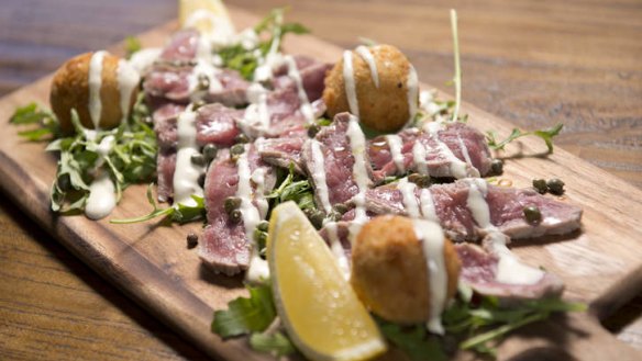 Vitello Tonnato: Poached veal with potato and tuna fritters.