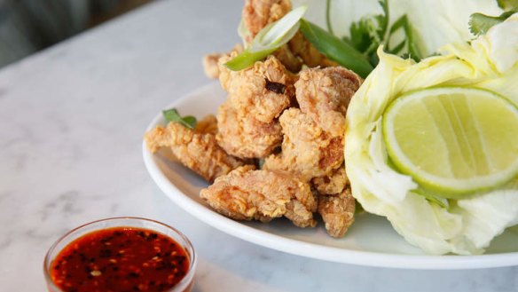 Korean fried chicken with iceberg lettuce, spring onion and chilli sesame.