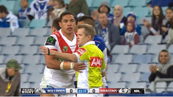 In trouble: Tyson Frizell touches referee Chris James on Friday night.