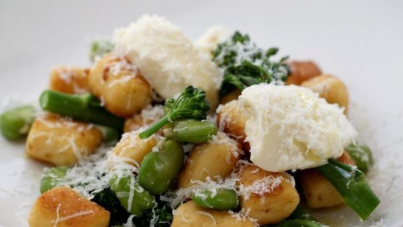 Choux pastry gnocchi with broad beans, broccolini and creamy squacquerone cheese.