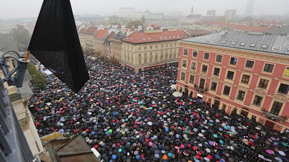Thousands of women participate in the nationwide Black Monday strike to protest a legislative proposal for a total ban on abortion in Warsaw, Poland, in October last year. 