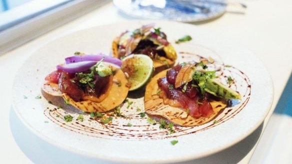 'Ceviche tulum tostaditas' - fish cooked in lime, tomato, onion and coriander on a tortilla. 