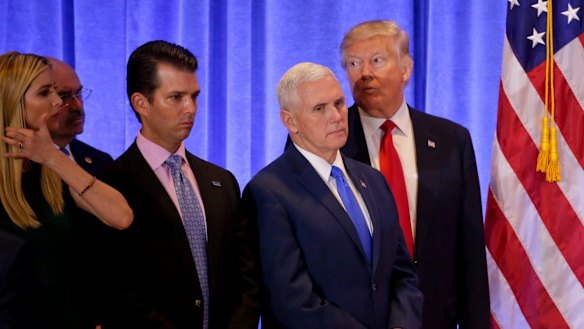 President-elect Donald Trump listens with Vice President-elect Mike Pence, daughter Ivanka Trump and Donald Trump Jr. as one of his attorneys speaks during a news conference.