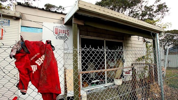 Hard times ... the abandoned demountable building at Lysaghts Oval still features the Wolves badge.