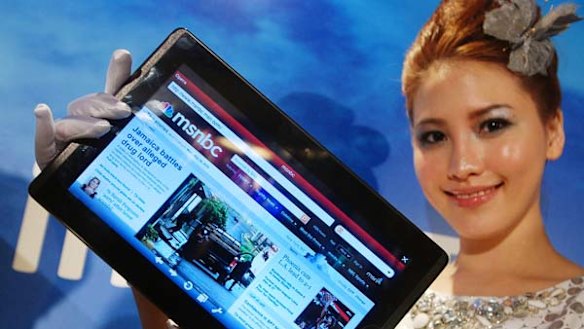A model displays an AsusTek Eee Pad EP101TC tablet computer at an AsusTek new product media event in Taipei, Taiwan.