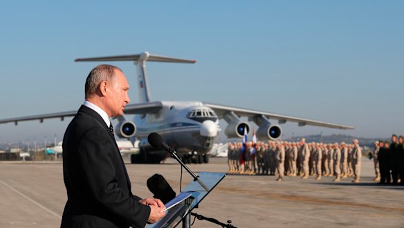 Russian President Vladimir Putin addresses the troops at the Hemeimeem air base in Syria in December 2017.
