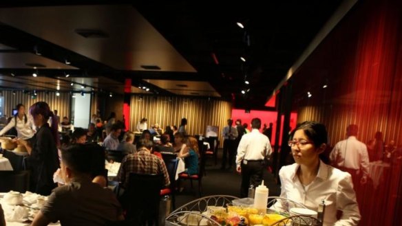 A lunchtime crowd enjoys yum cha at the East Phoenix Restaurant in Zetland, Sydney.