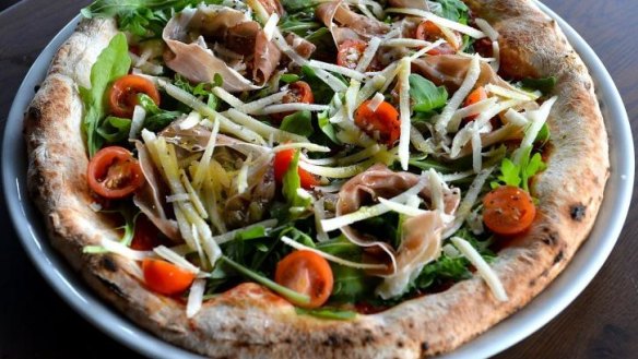 Violetta's primavera pizza with rocket, tomato, mozzarella, parmigiano and prosciutto.