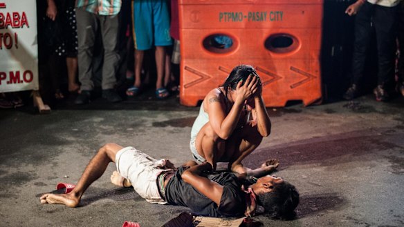 The killers had written "drug pusher" on a piece of cardboard and left it beside Michael Siaron.