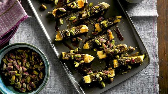 Haloumi wrapped in vine leaves with pistachios, zaatar and pomegranate molasses.